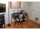 Dedicated office space featuring a black desk with a white chair, offering a functional workspace at 1126 Tarridon Ct, Dunedin, FL 34698