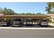 Convenient covered parking area with multiple vehicles at 1126 Tarridon Ct, Dunedin, FL 34698