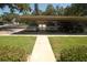 Assigned covered parking near building entrance at 1126 Tarridon Ct, Dunedin, FL 34698