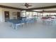 Community recreation room with ping pong table, tables, and chairs for activities and socializing at 1126 Tarridon Ct, Dunedin, FL 34698