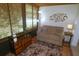 Cozy sun room featuring natural light with blinds, comfortable seating, and stylish decor at 1126 Tarridon Ct, Dunedin, FL 34698