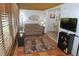 Inviting sunroom with plenty of light and cozy seating at 1126 Tarridon Ct, Dunedin, FL 34698