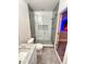 Modern bathroom featuring a glass shower and updated fixtures at 1147 Halapa Way, Trinity, FL 34655