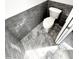 Modern bathroom with gray subway tile and floor with toilet at 1147 Halapa Way, Trinity, FL 34655