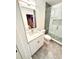 Elegant bathroom featuring a glass shower and updated fixtures at 1147 Halapa Way, Trinity, FL 34655