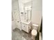 Modern bathroom featuring a white vanity, decorative backsplash, and contemporary fixtures at 1147 Halapa Way, Trinity, FL 34655