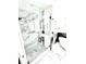 Sleek bathroom featuring a glass shower, marble accents, and modern design at 1147 Halapa Way, Trinity, FL 34655