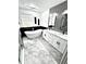Modern bathroom featuring a soaking tub, double vanity, and sleek design at 1147 Halapa Way, Trinity, FL 34655
