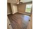 Bedroom with hardwood floors, a window, a closet, and gray-painted walls at 1147 Halapa Way, Trinity, FL 34655