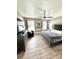 Cozy bedroom with a platform bed, modern decor, and bright natural light at 1147 Halapa Way, Trinity, FL 34655