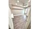 A bright bedroom with sleek wood floors and a modern ceiling fan at 1147 Halapa Way, Trinity, FL 34655