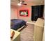 Cozy bedroom with a ceiling fan, dark curtains, and hardwood floors at 1147 Halapa Way, Trinity, FL 34655