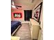 Bedroom with a ceiling fan, dark curtains, hardwood floors, and a picture on the wall at 1147 Halapa Way, Trinity, FL 34655