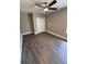 Bedroom with hardwood floors, a window, a closet, and gray-painted walls at 1147 Halapa Way, Trinity, FL 34655