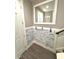 Entryway featuring modern wainscoting, coat hooks, and a large mirror creating an inviting space at 1147 Halapa Way, Trinity, FL 34655