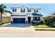 Charming two-story home with a well-maintained lawn, two car garage and a beautiful entrance at 1147 Halapa Way, Trinity, FL 34655