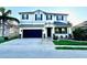 Charming two-story home with a well-maintained lawn, two car garage and a beautiful entrance at 1147 Halapa Way, Trinity, FL 34655