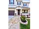 Stunning front entrance with beautiful brick columns, paver walkway and well-maintained landscaping at 1147 Halapa Way, Trinity, FL 34655