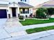 Stunning front entrance with beautiful brick columns, paver walkway and well-maintained landscaping at 1147 Halapa Way, Trinity, FL 34655