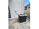 HVAC unit on a paved patio, ensuring climate control and comfort inside the home at 1147 Halapa Way, Trinity, FL 34655