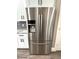 This kitchen has a stainless fridge with water dispenser at 1147 Halapa Way, Trinity, FL 34655