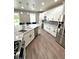 Modern kitchen boasts stainless appliances, white cabinets and lots of counter space at 1147 Halapa Way, Trinity, FL 34655