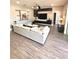 Open living room with hardwood floors and modern furniture, creating an inviting space at 1147 Halapa Way, Trinity, FL 34655