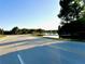 View of the road winding past a picturesque pond at 1147 Halapa Way, Trinity, FL 34655