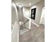 Bright staircase with chandelier and elegant wood-look flooring at 1147 Halapa Way, Trinity, FL 34655