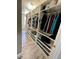 Spacious walk-in closet with custom shelves and drawers, providing ample storage at 1147 Halapa Way, Trinity, FL 34655