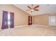 Spacious bedroom featuring vaulted ceilings, a ceiling fan, and plenty of natural light at 12846 Tallowood Dr, Riverview, FL 33569