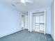 Cozy bedroom featuring plush carpet, ceiling fan, and a closet with ample storage, creating a comfortable retreat at 12846 Tallowood Dr, Riverview, FL 33569