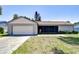 Charming single-story home featuring an attached garage, screened front porch and a well-maintained lawn at 12846 Tallowood Dr, Riverview, FL 33569