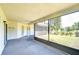 Covered screened patio overlooking the landscaped backyard and pond, perfect for outdoor relaxation and entertaining at 12846 Tallowood Dr, Riverview, FL 33569