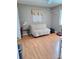 Bright room with neutral walls, wood-look floors, and natural light at 1291 Stony Brook Ln, Dunedin, FL 34698