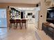Bright kitchen with white cabinetry, modern appliances, and a breakfast bar at 1291 Stony Brook Ln, Dunedin, FL 34698