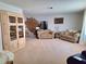 Spacious living room with neutral carpet and stylish decor at 1291 Stony Brook Ln, Dunedin, FL 34698