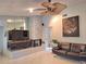 Cozy living room featuring a stone fireplace and modern furnishings at 1291 Stony Brook Ln, Dunedin, FL 34698