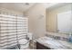 Bathroom featuring a vanity with granite countertop, a mirror, and a shower with a striped curtain at 13246 Kent Bradley St, Dade City, FL 33525
