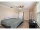 Bright bedroom with neutral walls, a ceiling fan, and a view to connected spaces at 13246 Kent Bradley St, Dade City, FL 33525