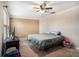 Comfortable bedroom features carpet, a ceiling fan, and natural light from the window at 13246 Kent Bradley St, Dade City, FL 33525