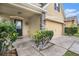 Inviting front porch area with stone-accented columns, and a well-maintained landscape at 13246 Kent Bradley St, Dade City, FL 33525