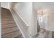 Open staircase and light-filled foyer area with a decorative light fixture at 13246 Kent Bradley St, Dade City, FL 33525