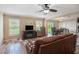 Spacious living room with wood floors and a fireplace at 13246 Kent Bradley St, Dade City, FL 33525