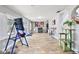 Bonus room with access to backyard, wood look tile flooring, and natural light through windows and glass doors at 13263 86Th Ave, Seminole, FL 33776