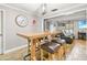 Dining area featuring a high-top table, seating, and views into the open living room at 13263 86Th Ave, Seminole, FL 33776