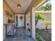 Inviting front porch with decorative features, offering a warm welcome to guests at 13263 86Th Ave, Seminole, FL 33776
