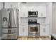 Modern kitchen with stainless steel appliances, plenty of storage, and updated finishes at 13263 86Th Ave, Seminole, FL 33776