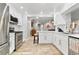 Bright, updated kitchen featuring white cabinets, stainless steel appliances, and tile flooring at 13263 86Th Ave, Seminole, FL 33776