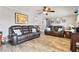Comfortable living room with leather sofas, decorative pillows, and stylish tile flooring at 13263 86Th Ave, Seminole, FL 33776